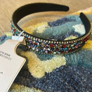 Multicolored, rainbow rhinestone embellished headband.